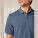 Unisex polo tričko Prepster 2.0 - stpu222-darkheatherblue_studio_lifestyle_detail_front - variant Eg STPU222C6521L
