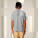 Unisex polo tričko Prepster 2.0 - stpu222-heathergrey_studio_lifestyle_main_back - variant Eg STPU222C2501M