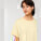 Stella Collider dámské tričko s ohrnutým rukávem - sttw089-butter_studio_lifestyle_detail_front - variant Eg STTW089C0781L