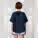 Stella Collider dámské tričko s ohrnutým rukávem - sttw089-frenchnavy_studio_lifestyle_main_back - variant Eg STTW089C7271L