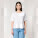 Stella Collider dámské tričko s ohrnutým rukávem - sttw089-white_studio_lifestyle_main_front - variant Eg STTW089C0011L